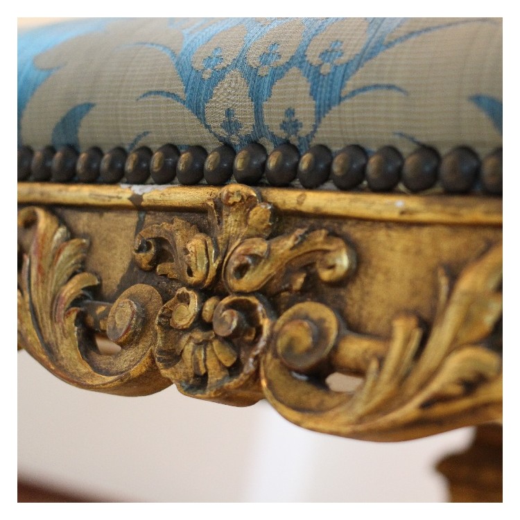 A Louis XIV style carved giltwood fauteuil